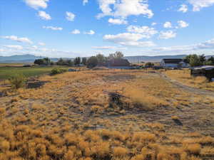 View of mountain backdrop with rural landscape