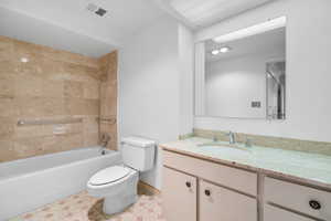 Full bathroom with shower / bath combination, vanity, and light tile patterned flooring