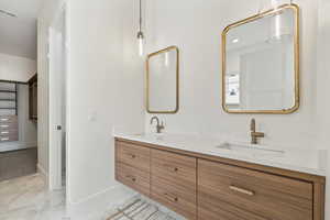 Bathroom featuring double vanity and recessed lighting