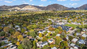 View of property location with mountains and nearby suburban area