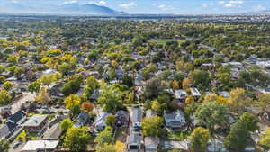View of property location featuring mountains and nearby suburban area