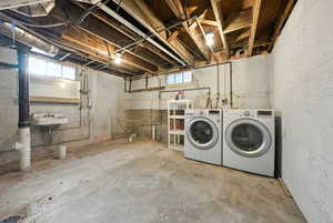 Below grade area with washer and clothes dryer