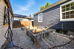 View of patio featuring a vegetable garden