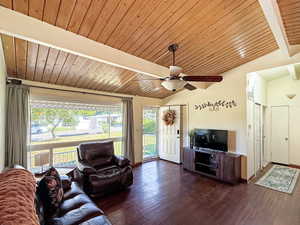 Vaulted ceiling and wood floor living space
