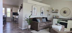 Living room with a fireplace and wood finished floors