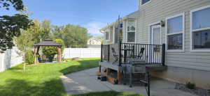 Fenced backyard with a gazebo and a patio