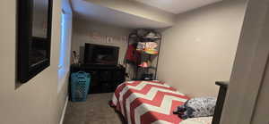 Bedroom with carpet and baseboards