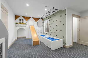 Bathroom featuring recessed lighting and a freestanding tub