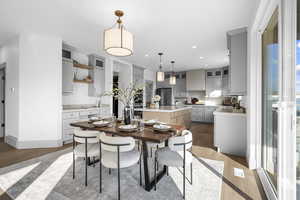 Dining area featuring wood finished floors and recessed lighting
