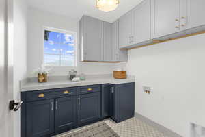 Washroom with cabinet space and hookup for a washing machine