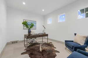 Carpeted office featuring recessed lighting and baseboards