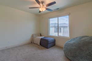 Bedroom featuring carpet flooring and a ceiling fan