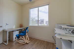 Office featuring wood finish floors and ceiling fan