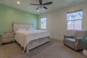 Bedroom featuring recessed lighting, light carpet, and a ceiling fan