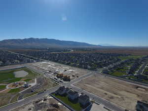 Aerial view of property's location with nearby suburban area