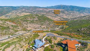 Aerial view of a mountain backdrop to the north.