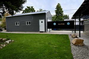 View of outdoor structure with a gate