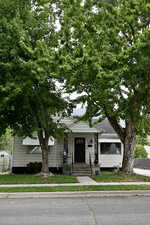 View of front of house with a front yard