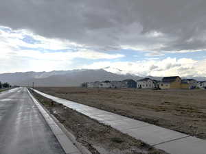 View of mountain backdrop with nearby suburban area