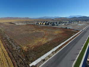 View of mountain backdrop featuring nearby suburban area