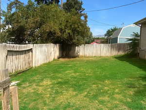 View of fenced backyard
