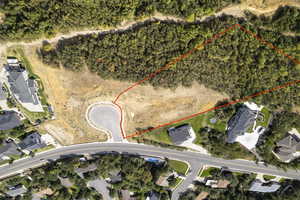 Aerial view of the lot featuring property parcel outlined