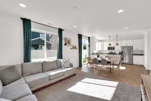 Living area featuring recessed lighting and light wood finished floors