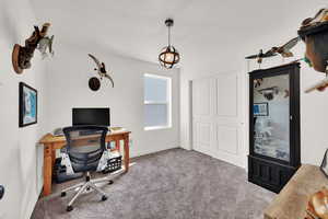 Carpeted office featuring baseboards