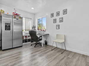 Office with baseboards and light wood finished floors