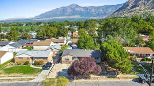 Aerial view of residential area featuring a mountain backdrop
