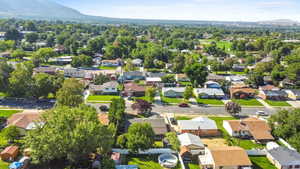 Aerial perspective of suburban area with a mountain backdrop