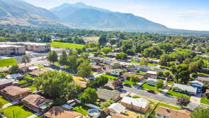 Aerial perspective of suburban area with a mountainous background