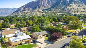 Aerial view of residential area featuring a mountainous background