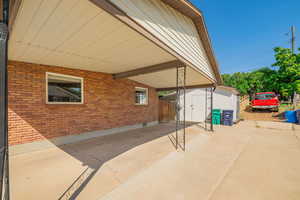 View of patio / terrace with a shed