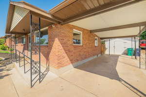 View of patio / terrace featuring a shed