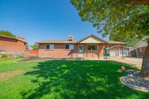 Ranch-style house featuring brick siding and concrete driveway