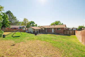 Fenced backyard featuring a patio area