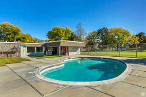 Community pool with a patio area