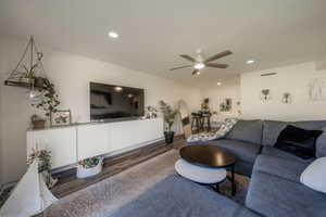 Living room featuring wood finished floors, recessed lighting, and ceiling fan