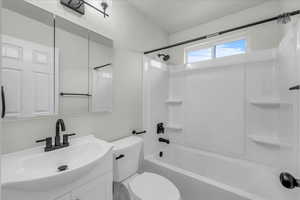 Bathroom featuring bathtub / shower combination and vanity