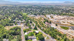 Aerial view of residential area featuring a mountain backdrop