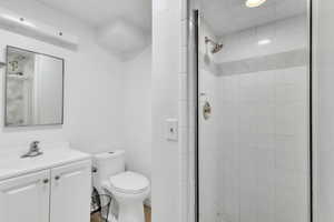 Bathroom with vanity and a stall shower
