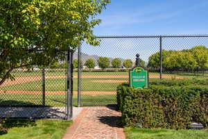 View of community with a gate and a dog friendly area