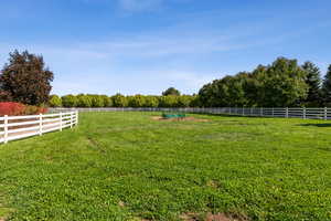 View of yard with a rural view