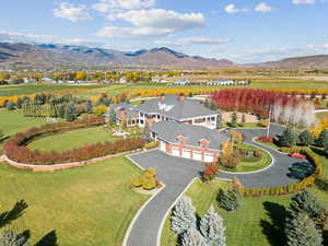View from above of property with a mountain backdrop