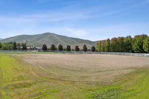 View of mountain backdrop with rural landscape