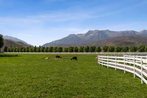 View of mountain backdrop with rural landscape