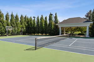 View of tennis court with community basketball court
