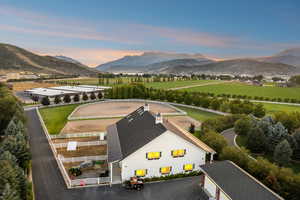 Aerial view at dusk of a mountain view and a view of rural / pastoral area