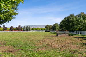 View of yard featuring a mountain view and a rural view